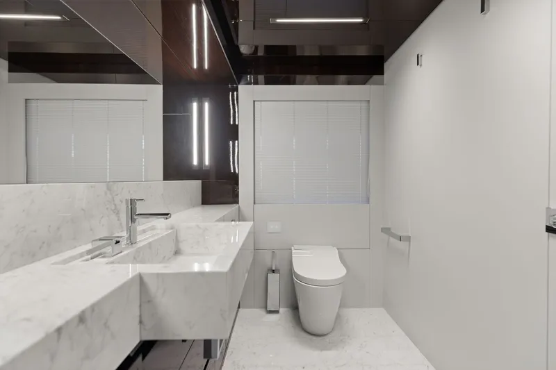 Slide: The Image of Luxurious bathroom interior on 2022 Riva 110' Dolcevita yacht, featuring sleek marble design. - 50