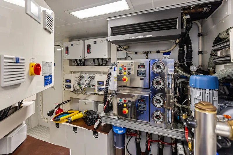 Slide: The Image of Engine room of 2022 Riva 110' Dolcevita yacht with control panels and equipment. - 61