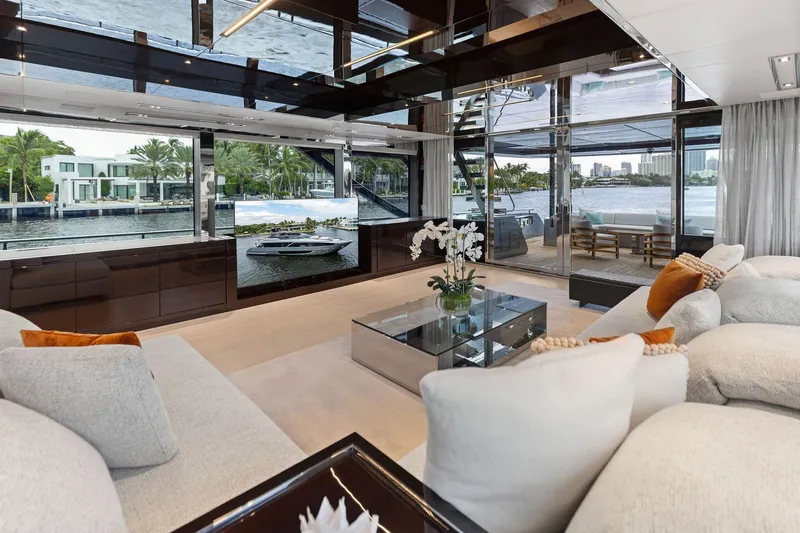 Slide: The Image of Luxurious interior of 2022 Riva 110' Dolcevita yacht with elegant seating and waterfront views. - 24