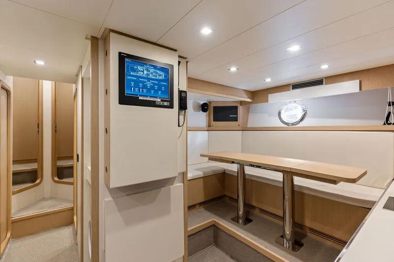 Slide: The Image of Luxurious interior of 2022 Riva 110' Dolcevita yacht with modern seating and control panel. - 67