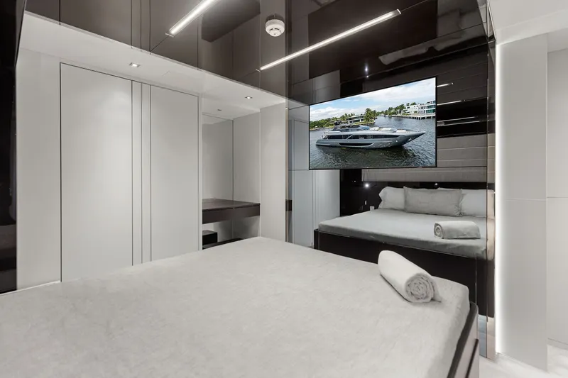 Slide: The Image of Luxurious bedroom interior on 2022 Riva 110' Dolcevita yacht with modern design and TV display. - 52