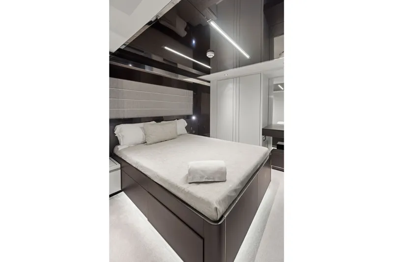 Slide: The Image of Luxurious bedroom interior on 2022 Riva 110' Dolcevita yacht, featuring modern design and elegant furnishings. - 51