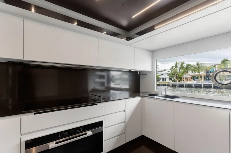 Slide: The Image of Modern kitchen interior on 2022 Riva 110' Dolcevita yacht with waterfront view. - 36