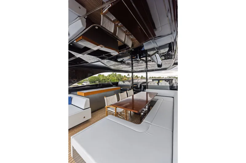 Slide: The Image of Luxurious 2022 Riva 110' Dolcevita yacht interior with elegant seating and dining area. - 17