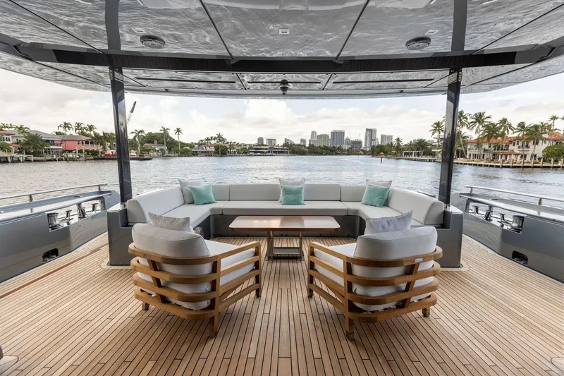 Slide: The Image of Luxurious deck seating on 2022 Riva 110' Dolcevita yacht overlooking waterfront. - 23
