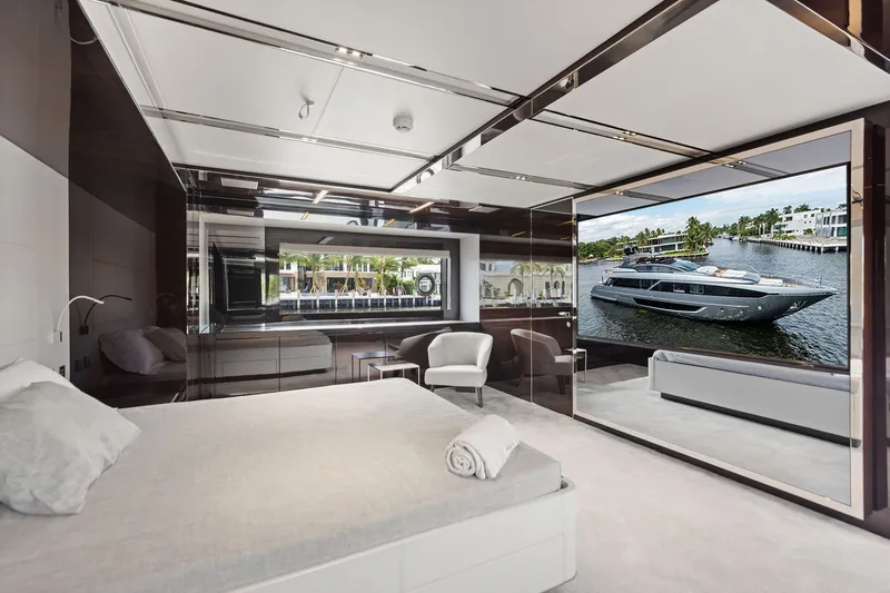 Slide: The Image of Luxurious bedroom interior on 2022 Riva 110' Dolcevita yacht with modern design and large window view. - 41