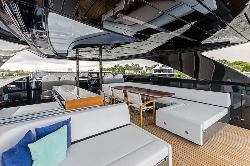 Slide: The Image of Luxurious 2022 Riva 110' Dolcevita yacht deck with elegant seating and dining area. - 16