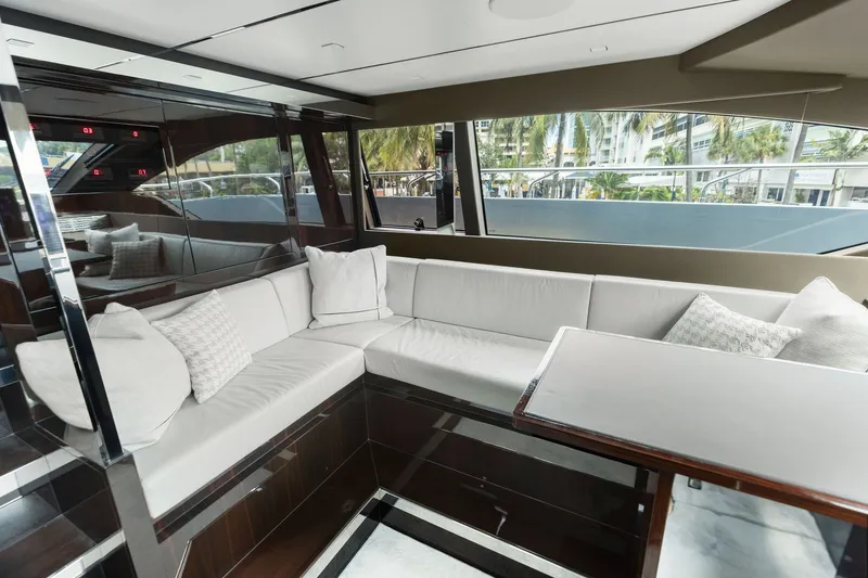 Slide: The Image of Luxurious interior of 2022 Riva 110' Dolcevita yacht with elegant seating and large windows. - 33