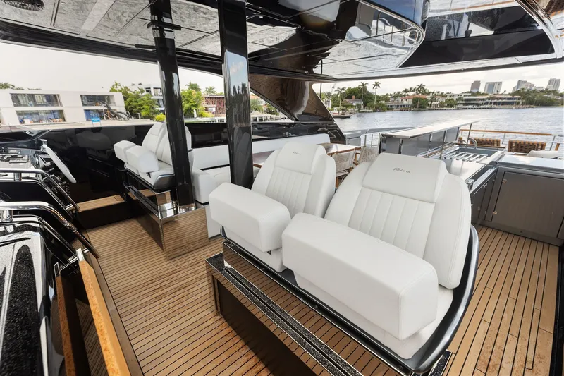 Slide: The Image of Luxurious 2022 Riva 110' Dolcevita yacht interior with sleek white seating and elegant design. - 20