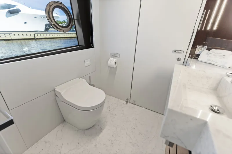 Slide: The Image of Luxurious bathroom on 2022 Riva 110' Dolcevita yacht with modern fixtures and ocean view. - 56