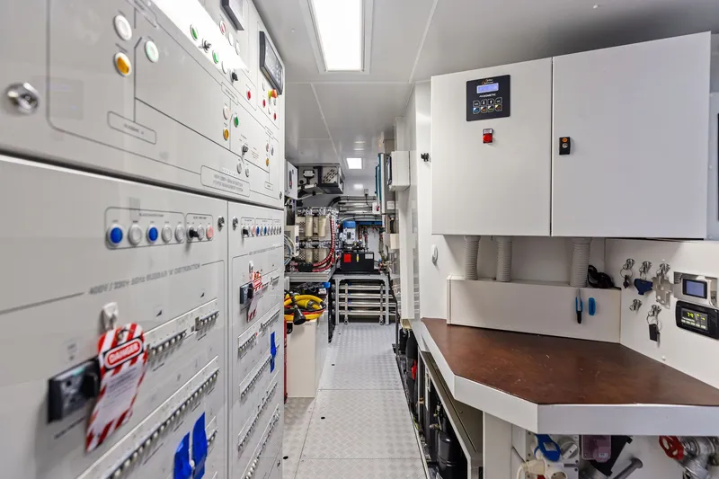 Slide: The Image of Engine room of 2022 Riva 110' Dolcevita yacht with control panels and equipment. - 58