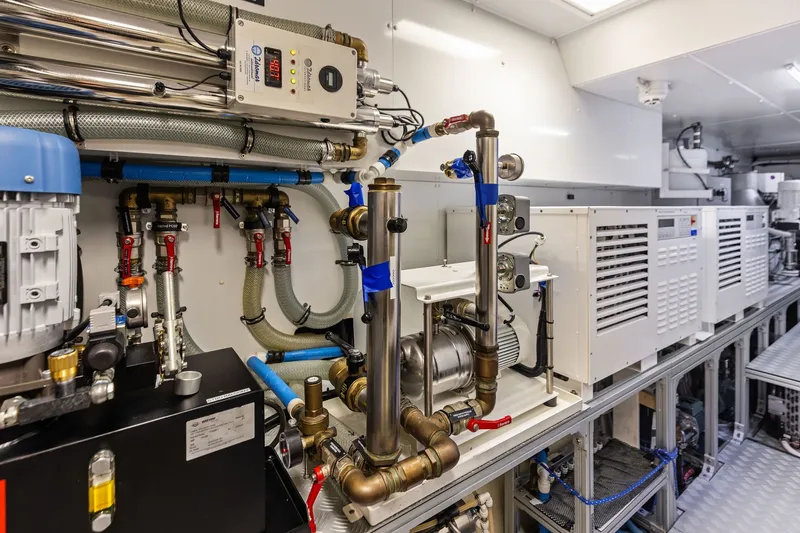 Slide: The Image of Engine room of 2022 Riva 110' Dolcevita yacht, showcasing advanced mechanical systems. - 60