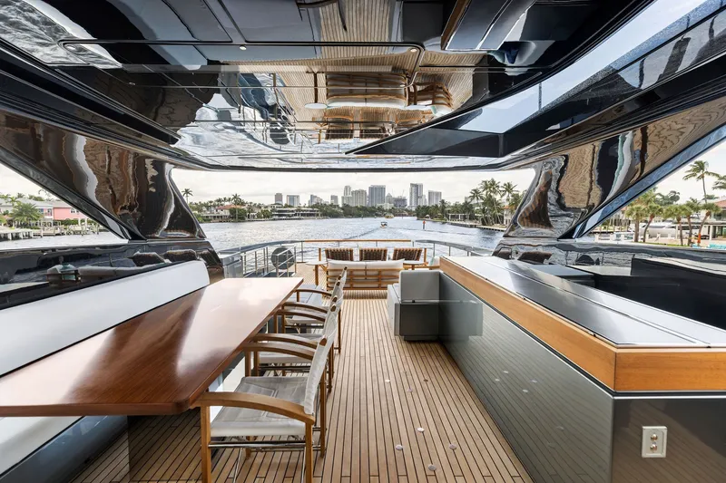 Slide: The Image of Luxurious 2022 Riva 110' Dolcevita yacht interior with elegant dining area and waterfront view. - 18