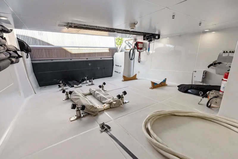 Slide: The Image of Interior view of 2022 Riva 110' Dolcevita yacht garage with equipment and storage space. - 65
