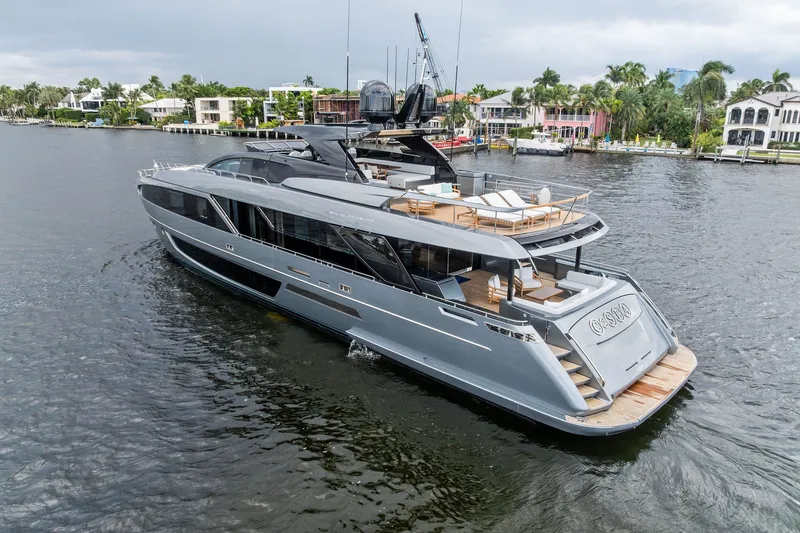 Slide: The Image of Luxurious 2022 Riva 110' Dolcevita yacht cruising on a scenic waterfront. - 5