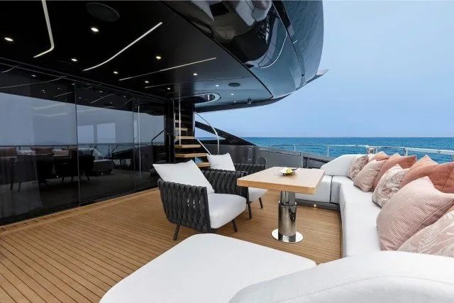 Slide: The Image of Luxurious deck of 2024 Mangusta GranSport 33 yacht with elegant seating and ocean view. - 13
