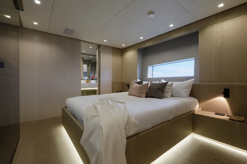 Slide: The Image of Luxurious bedroom interior of 2024 Mangusta GranSport 33 yacht, featuring modern design and ambient lighting. - 44