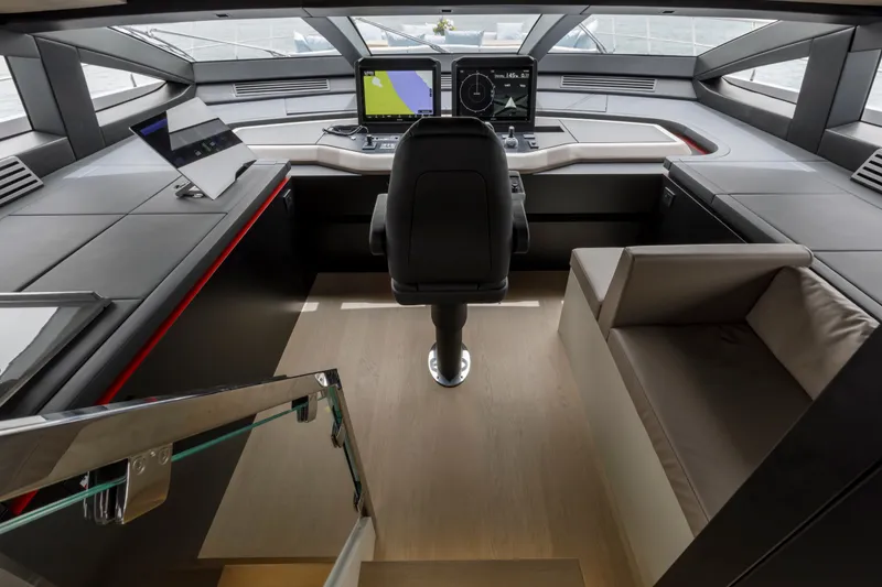 Slide: The Image of 2024 Mangusta GranSport 33 yacht cockpit with modern navigation systems and sleek design. - 39
