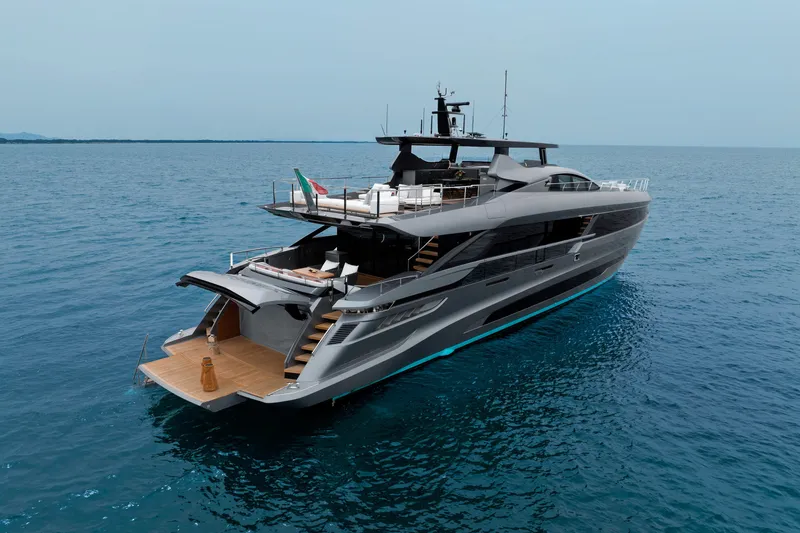 Slide: The Image of 2024 Mangusta GranSport 33 luxury yacht cruising on open sea. - 12