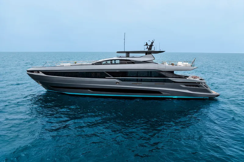 Slide: The Image of 2024 Mangusta GranSport 33 luxury yacht cruising on open sea. - 13