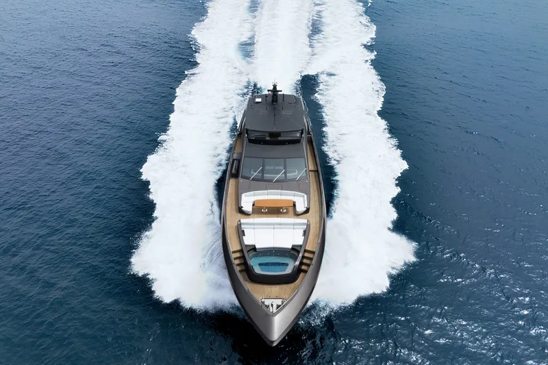 Slide: The Image of 2024 Mangusta GranSport 33 yacht cruising on open sea, aerial view. - 3