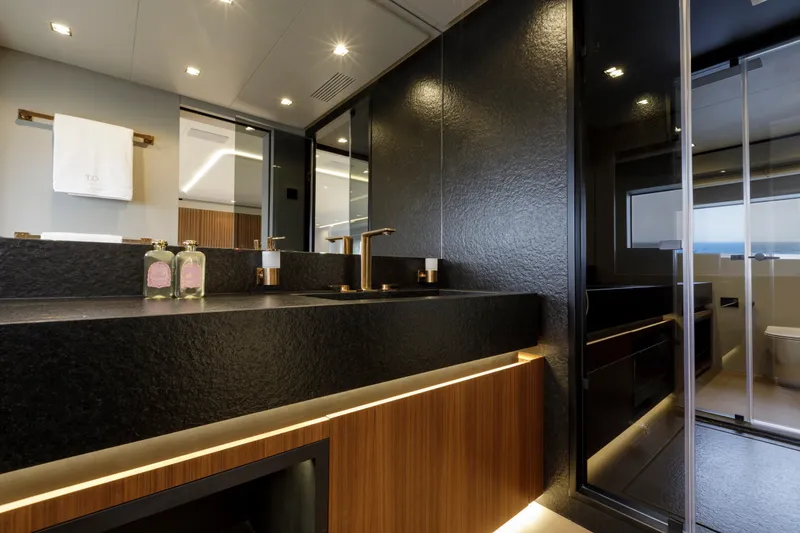 Slide: The Image of Luxurious bathroom interior of 2024 Mangusta GranSport 33 yacht with modern fixtures and elegant design. - 33
