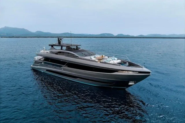 The Image of 2024 Mangusta GranSport 33 luxury yacht cruising on open water. - 5