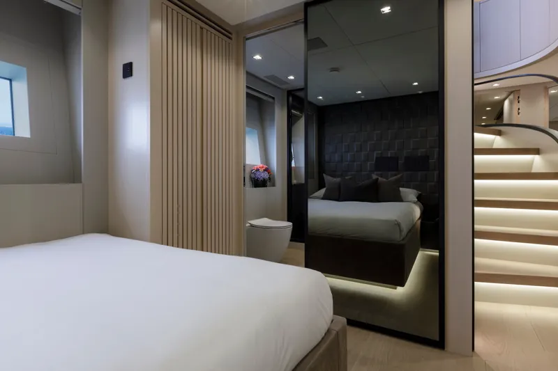 Slide: The Image of Luxurious bedroom interior of 2024 Mangusta GranSport 33 yacht with modern design and ambient lighting. - 49