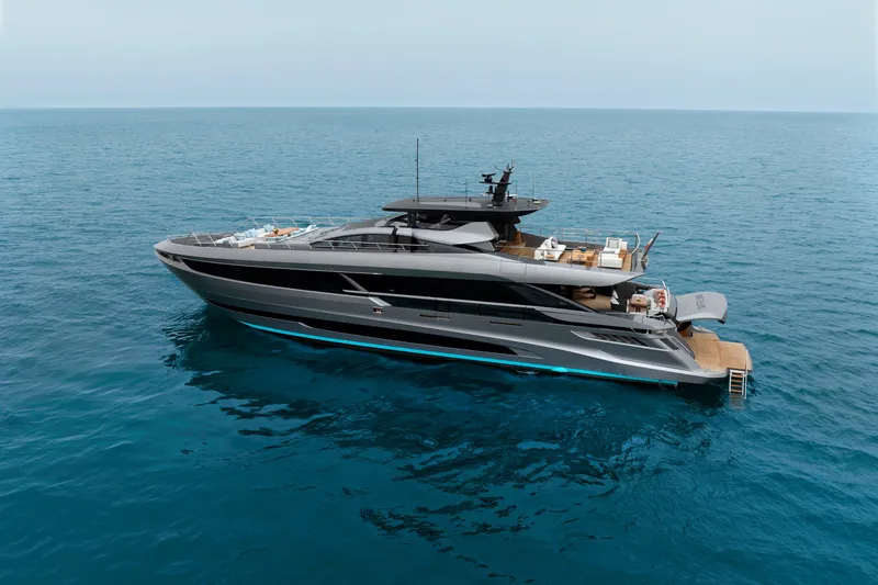 Slide: The Image of 2024 Mangusta GranSport 33 luxury yacht cruising on open sea. - 10