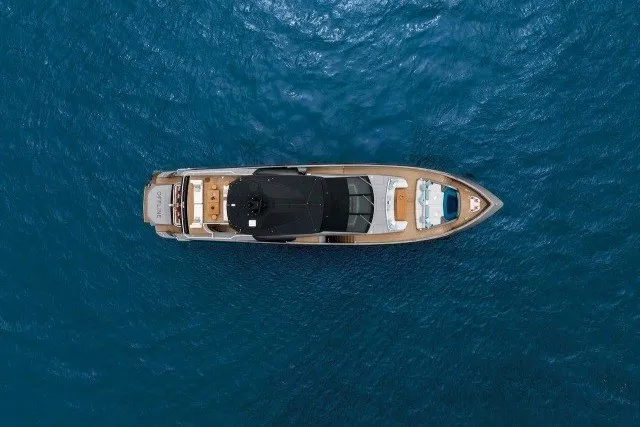 Slide: The Image of Aerial view of 2024 Mangusta GranSport 33 yacht on open blue sea. - 44