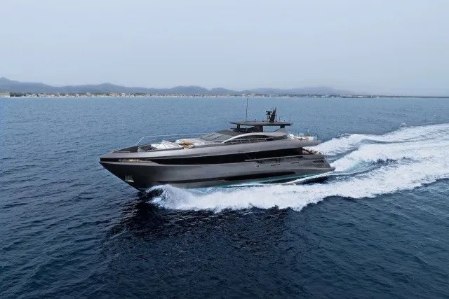 The Image of 2024 Mangusta GranSport 33 yacht cruising on open water, showcasing sleek design and luxury. - 0