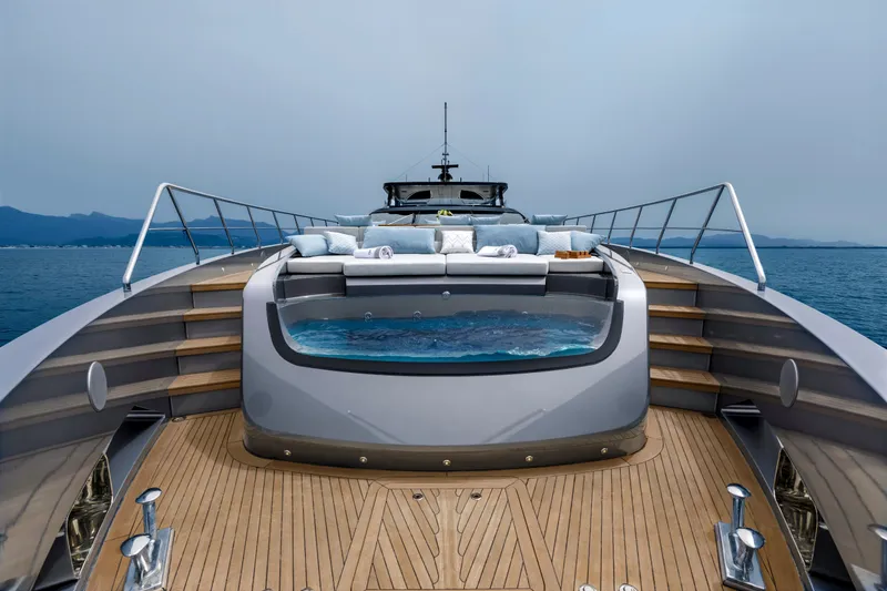 Slide: The Image of Luxurious 2024 Mangusta GranSport 33 yacht deck with jacuzzi and ocean view. - 64