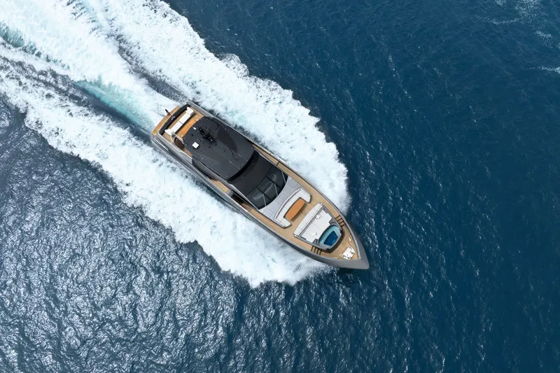 Slide: The Image of Aerial view of 2024 Mangusta GranSport 33 yacht cruising on open sea. - 5