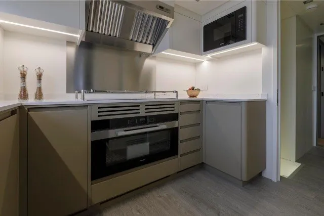 Slide: The Image of Modern kitchen in 2024 Mangusta GranSport 33 yacht with sleek appliances and cabinetry. - 17