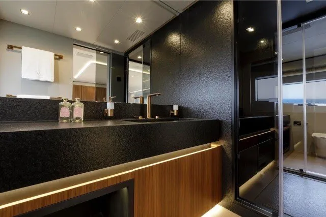 Slide: The Image of Luxurious bathroom interior of 2024 Mangusta GranSport 33 yacht, featuring modern design and elegant fixtures. - 23