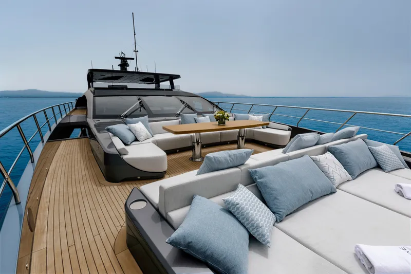 Slide: The Image of Luxurious 2024 Mangusta GranSport 33 yacht deck with elegant seating and ocean view. - 62