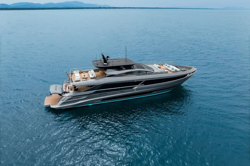 Slide: The Image of 2024 Mangusta GranSport 33 luxury yacht cruising on open sea. - 9