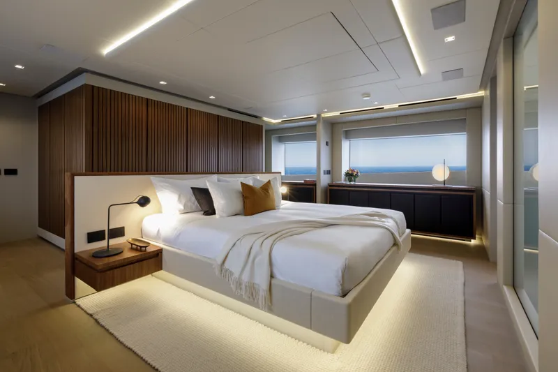 Slide: The Image of Luxurious bedroom interior of 2024 Mangusta GranSport 33 yacht, featuring modern design and ambient lighting. - 28