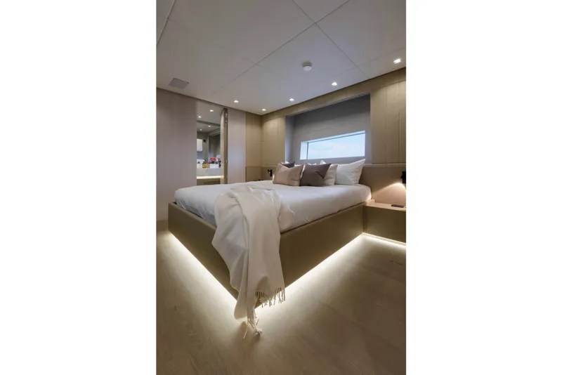 Slide: The Image of Luxurious bedroom interior of 2024 Mangusta GranSport 33 yacht with modern lighting and elegant decor. - 43
