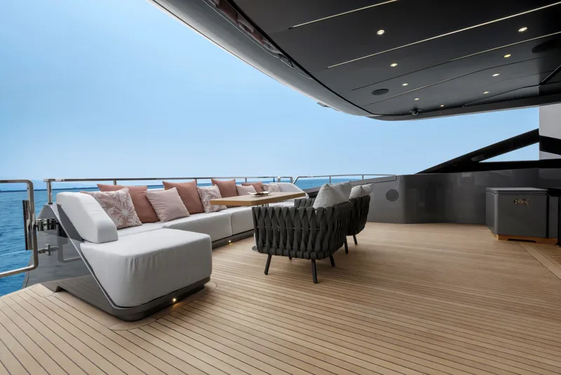 Slide: The Image of Luxurious deck of 2024 Mangusta GranSport 33 yacht with elegant seating and ocean view. - 17