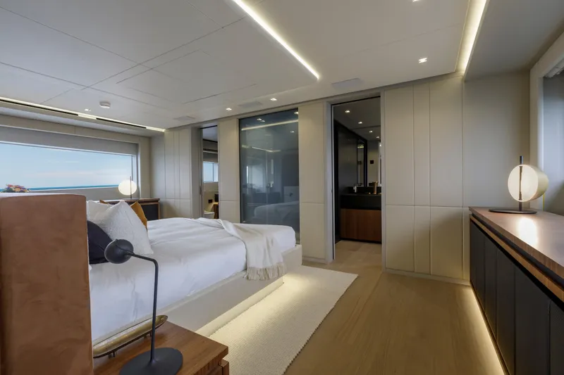 Slide: The Image of Luxurious bedroom interior of 2024 Mangusta GranSport 33 yacht, featuring modern design and ocean view. - 30
