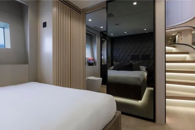 Slide: The Image of Luxurious interior of 2024 Mangusta GranSport 33 yacht, featuring elegant bedroom and modern design. - 26