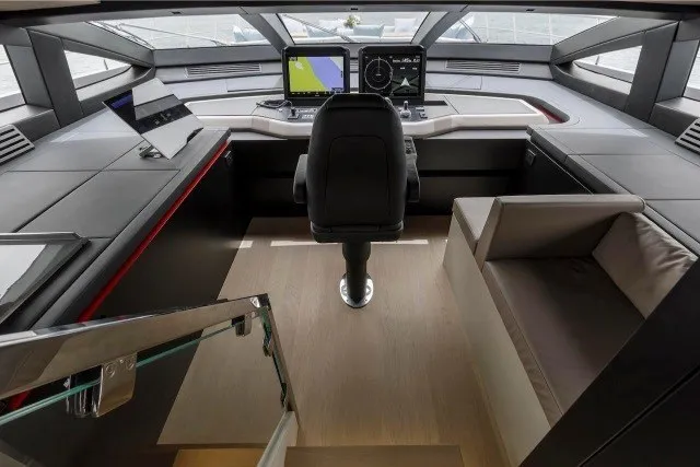 Slide: The Image of 2024 Mangusta GranSport 33 yacht cockpit with modern navigation systems and luxurious seating. - 33