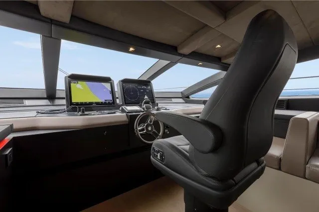Slide: The Image of 2024 Mangusta GranSport 33 yacht cockpit with modern navigation systems and luxurious seating. - 32