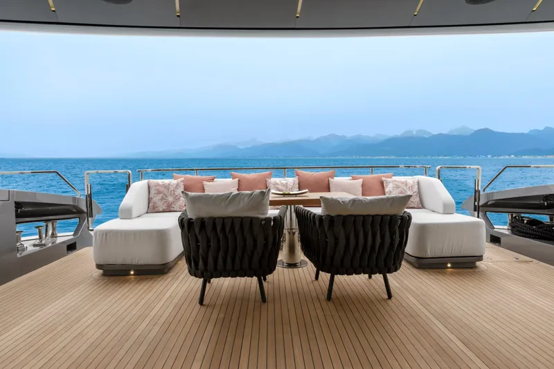 Slide: The Image of Luxurious deck of 2024 Mangusta GranSport 33 yacht with elegant seating and ocean view. - 16