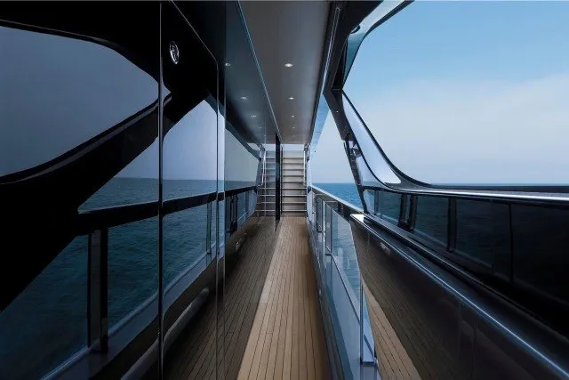 Slide: The Image of 2024 Mangusta GranSport 33 yacht deck with sleek design and ocean view. - 34