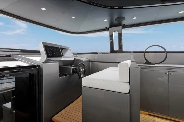 Slide: The Image of 2024 Mangusta GranSport 33 yacht helm with modern controls and sleek design. - 37