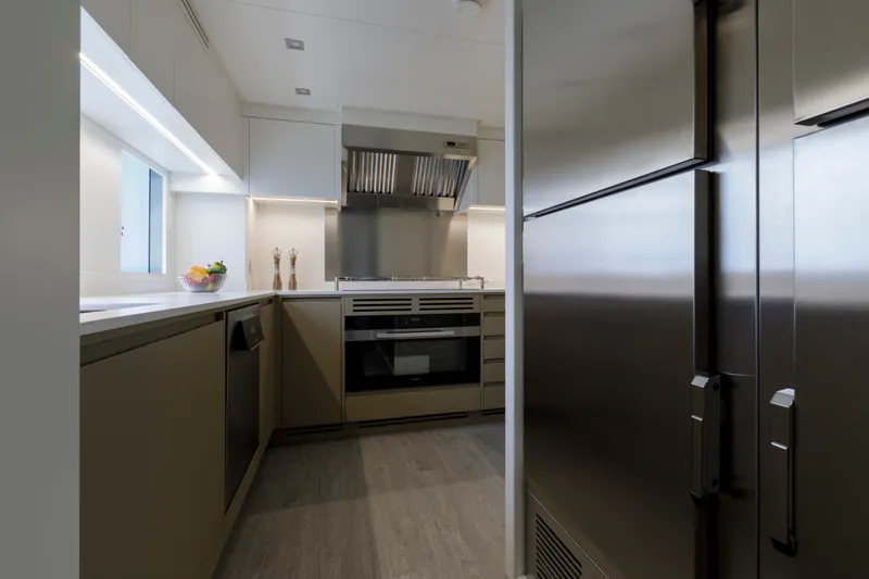 Slide: The Image of Modern kitchen interior on 2024 Mangusta GranSport 33 yacht, featuring sleek appliances and minimalist design. - 35