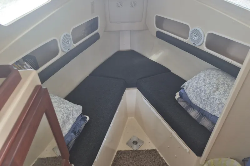 Slide: The Image of 2006 Rosborough RF-246 cabin interior with cushioned seating and pillows. - 13