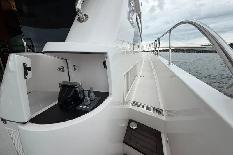 Slide: The Image of Luxury yacht Horizon E56 deck with control panel, sleek design, and ocean view. - 23